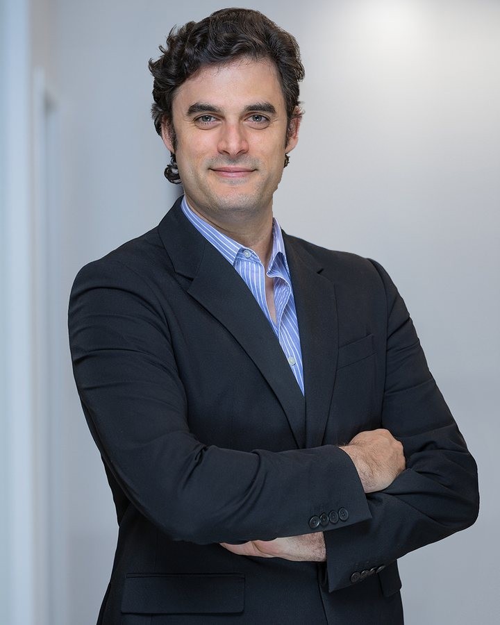 Executive headshot of Alejandro Alvarado, CarepointInsurance.com, photographed on location in Miami
