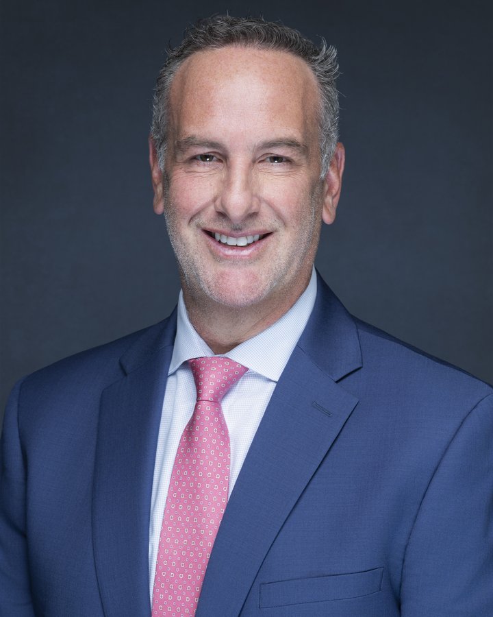 Executive headshot of Dr. Jason S. James, FemCare Ob-Gyn, photographed on location in Miami